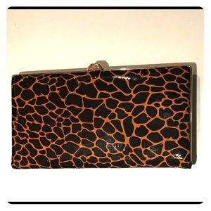 Lodi’s giraffe print pleather clutch/wallet